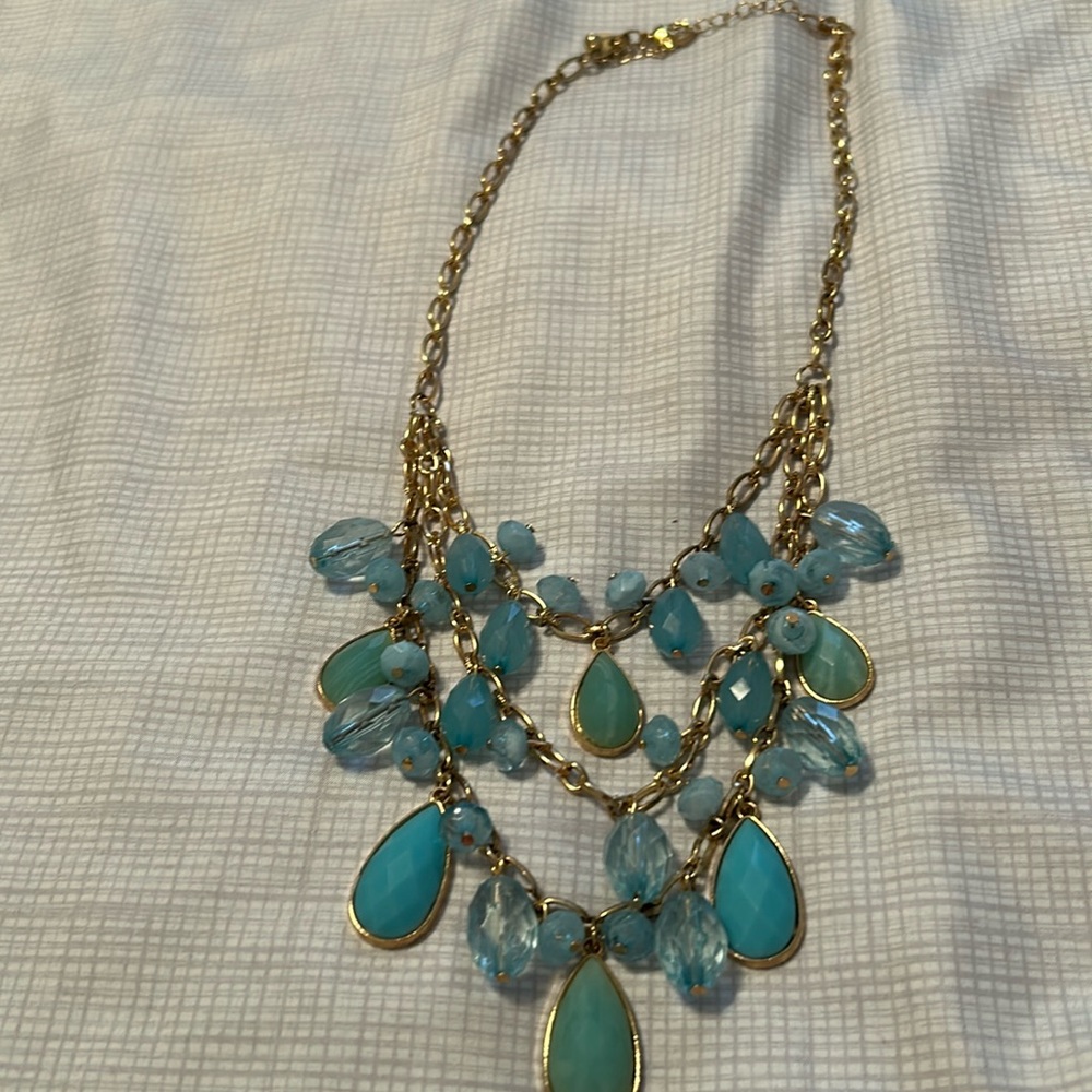 Tiered, jeweled, aquamarine, and gold necklace